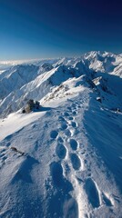 Snowy mountain ridge with footprints
