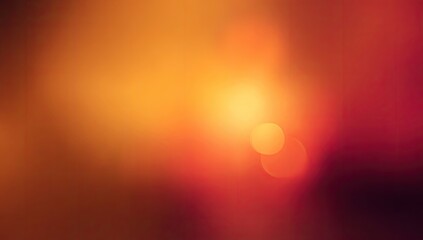 Abstract blurred background of warm colors, featuring bokeh circles of light