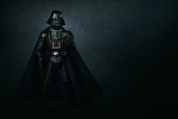 Naklejka premium Darth Vader action figure character from the Star Wars movie saga and space for text. Illustrative editorial