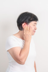 Elderly Woman having Ear pain for concept of Ear disease, Atresia, Otitis Media, Infection, Pertorated Eardrum, Meniere syndrome, Otolaryngologist, Hearing Loss, Hyperacusis, Tinnitus and Earwax
