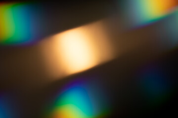 light leak overlay effect with bokeh rainbow light leaks,retro noisy film texture light leak flare on black background,abstract colorful background