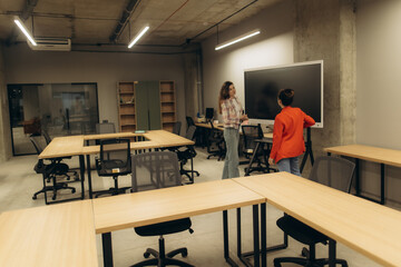Two Professionals Collaborating in a Modern Office Setting With Open Desk Setup
