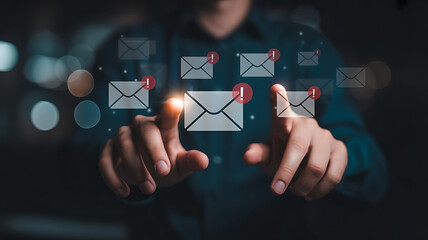 Person interacting with a digital interface displaying email icons and communication symbols on a dark background