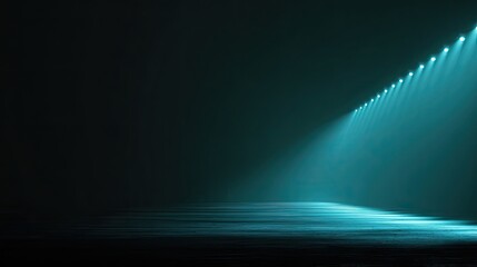 Empty stage lit by teal spotlights