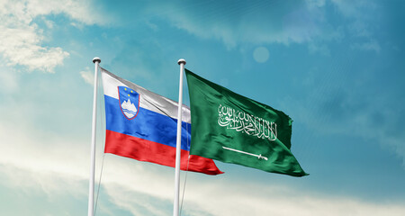 Slovenia and Saudi Arabia friendship flags are waving in the sky. Two country flag for agreement or deal. Slovenia KSA national flag for commitment.