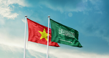 Vietnam and Saudi Arabia friendship flags are waving in the sky. Two country flag for agreement or...
