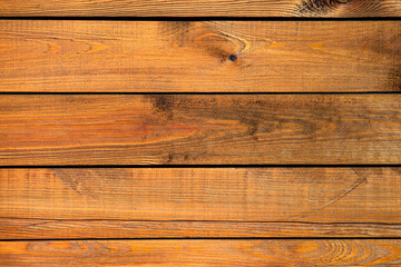 Obraz premium Wooden surface with rich texture and warm tones.