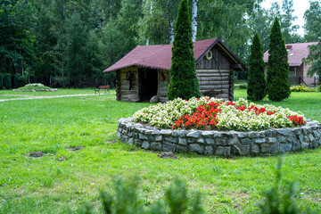 Polish countryside stone flower bed in summer garden