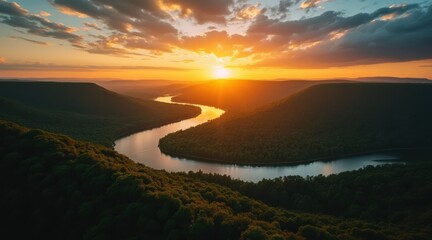 Majestic river winding through a valley at sunrise