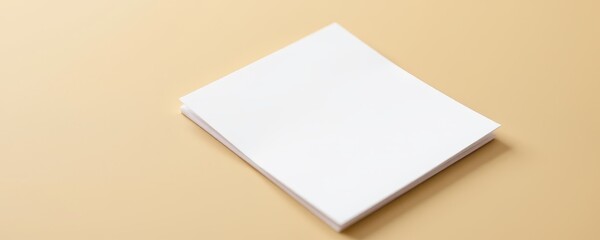 Stack of blank white paper sheets on a beige background copy space office