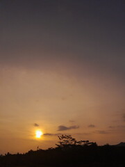 landscape photo of sunset at the rice paddy field