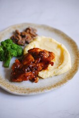 chicken steak with mashed potato and vegetables