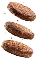 Three browned patties, appearing to float, against a black background