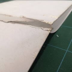 book cover old leather white. Damage to the side and broken pattern texture background.