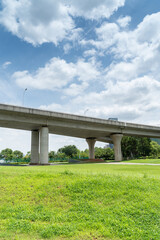 Looking up at a Large Interstate Highway Overpass and Blue Sky