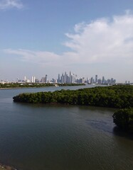 City skyline viewed over a river and islands