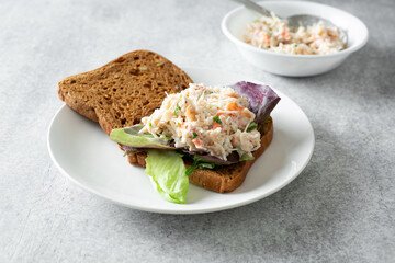 A view of a king crab salad open faced gluten-free sandwich.