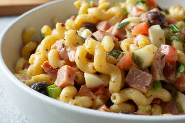 A closeup view of a gluten-free cavatappi pasta salad.