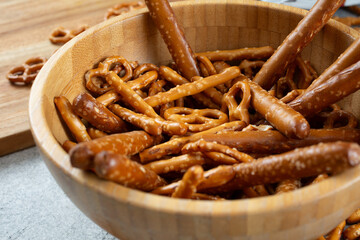 A closeup view of a bowl of assorted gluten-free pretzels.