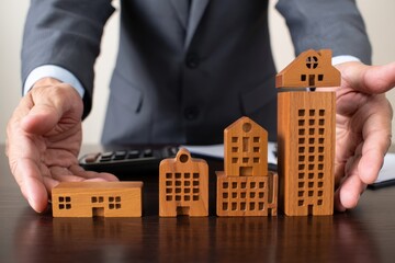 Real estate investment property management concept with wooden house models growth