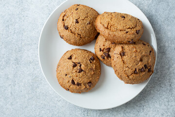 A top down view of a pile of gluten-free chocolate chip cookies.