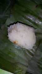 Indonesian Tradisional food called lemper contain rice cake with chicken inside.