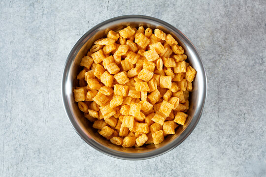 A top down view of a bowl of popular crunchy cereal.