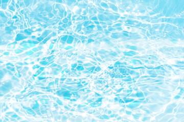 Blue water with ripples on the surface. Defocus blurred transparent blue colored clear calm water surface texture with splashes and bubbles. Water waves with shining pattern texture background.