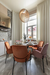 Bright Dining Area with Velvet Chairs and Elegant Table Setting