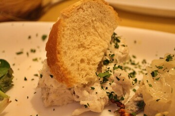 Italian cuisine: baccalà (dried and salted cod) with bread in Venice, Italy