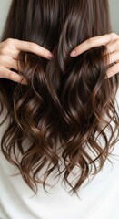 Captivating cascade: Lush brunette waves and textures showcasing hair beauty