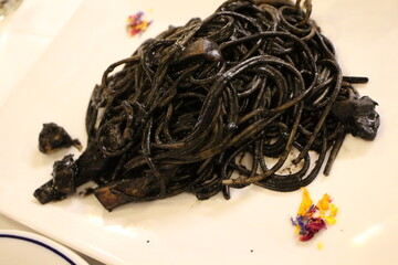 Italian cuisine: spaghetti with squid ink in Venice, Italy