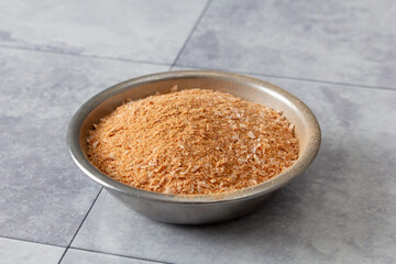 A view of a condiment cup of powdered shrimp.