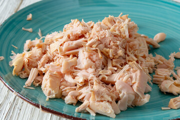 A closeup view of a pile of canned young jackfruit, on a plate.