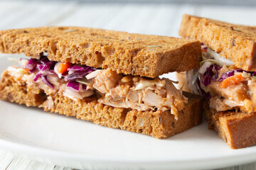 A closeup view of a jackfruit pulled pork sandwich.