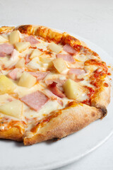A view of a Hawaiian pizza.