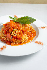 A view of a plate of cappellini pomodoro.