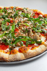A view of a deluxe pizza.