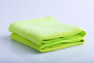 Folded bright lime green microfiber cloths