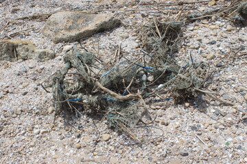 Old abandoned fishing net on shore