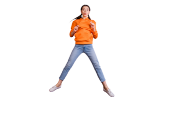 Full size photo of  funny funky millennial girl jump enjoy holidays moving wear modern outfit denim jeans white sneakers isolated over bright color background