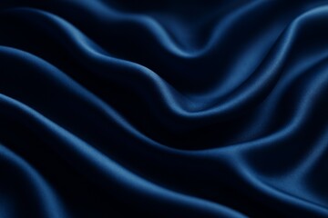 Abstract background of dark blue satin fabric. The soft, flowing texture of this luxury fabric creates an elegant and calm mood. A seamless loop of beautiful, wavy textile fabric.