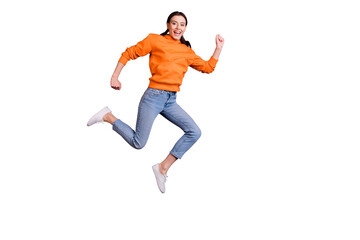 Full body photo of positive cheerful youth girl jump run after discounts feel content wear sportswear denim jeans white sneakers isolated over violet purple color background