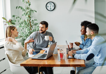 Group of young business people using laptop having a meeting or presentation and seminar in the office
