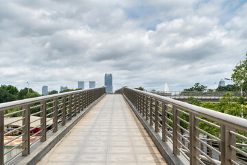 Pedestrian bridge against blue sky