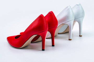 Red and white high heel shoes isolated on white background. A pair and white of red high heel shoes isolated. Red and white high heel women shoes. Shoe for women