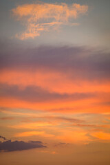 Vibrant sunset sky with orange and purple clouds
