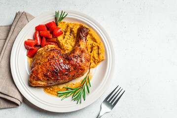 Autumn meal: roasted chicken quarter with mashed pumpkin