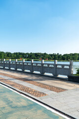 Stone fence beside the park river