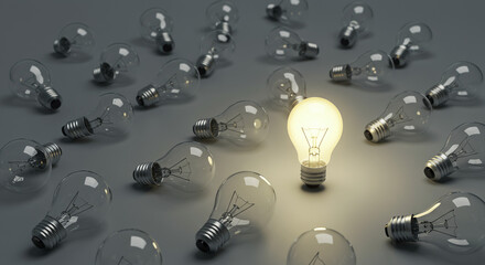 Bright Idea: One Illuminated Light Bulb Standing Out Amidst Unlit Ones